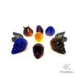 Colección circular de tapones de válvula Pracktico: incluye cascos de colores, calaveras azules y demonios negros y cobre.