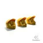 Tapones decorativos para válvula tipo casco de enduro color amarillo dorado.